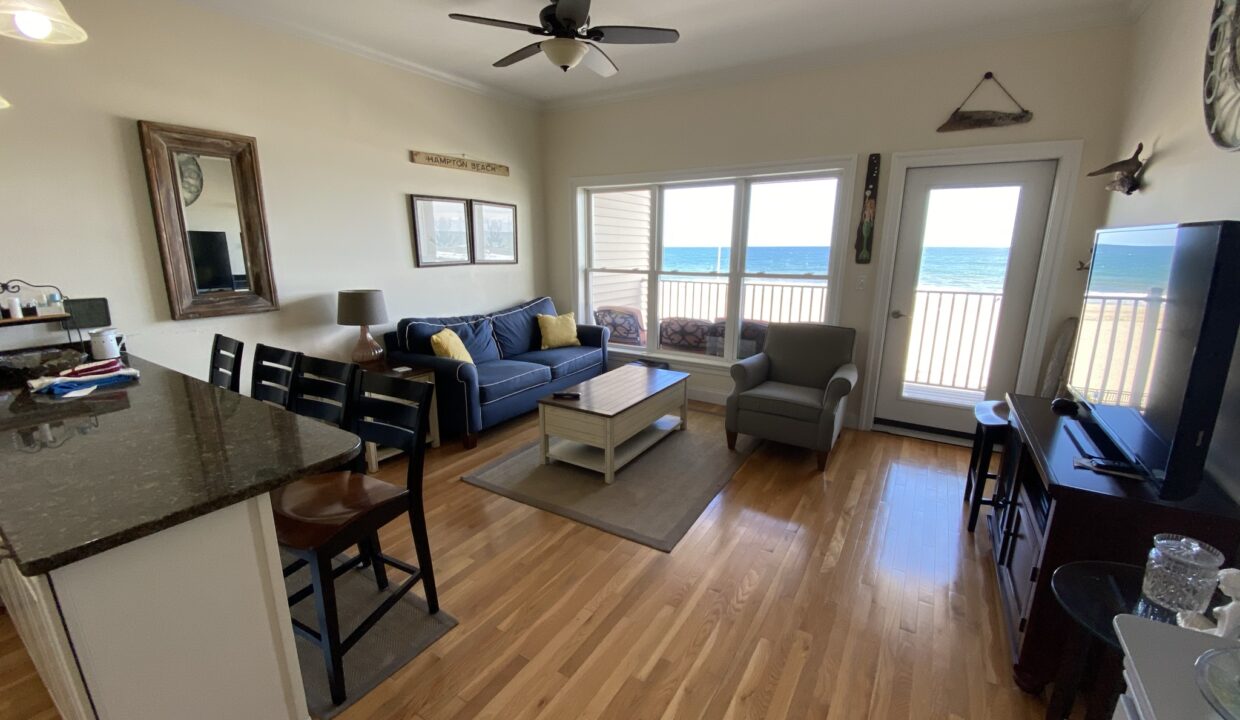 a living room filled with furniture and a flat screen tv.