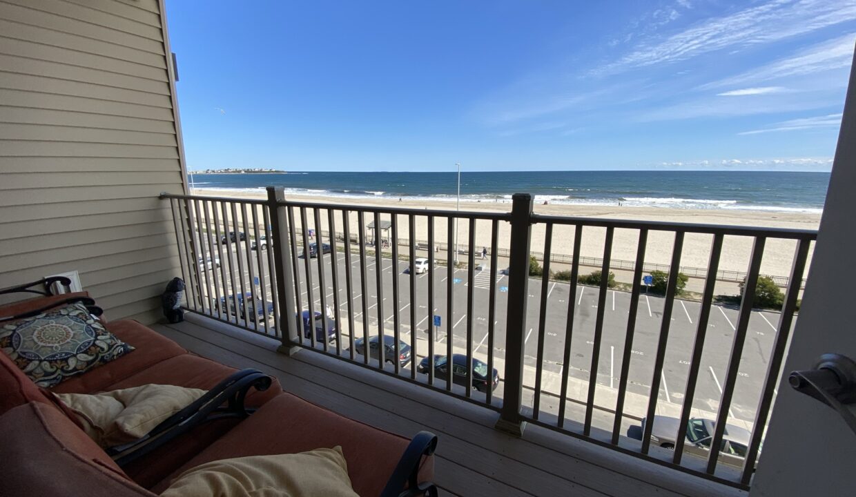 a balcony with a view of the beach.