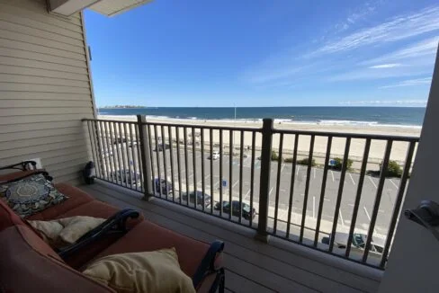 a balcony with a view of the beach.