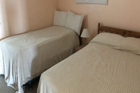 a couple of beds sitting next to each other in a bedroom.