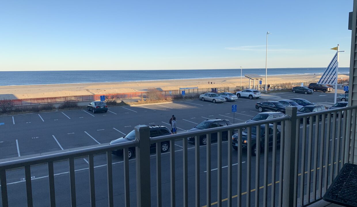 a view of a parking lot from a balcony.