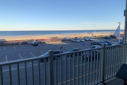 a view of a parking lot from a balcony.