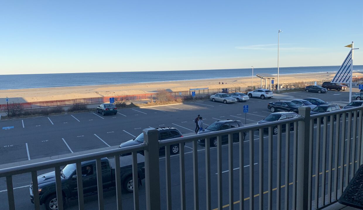 a view of a parking lot from a balcony.