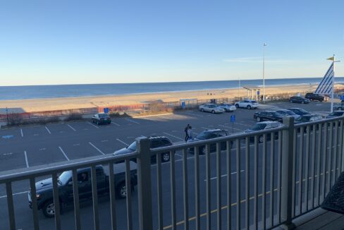 a view of a parking lot from a balcony.