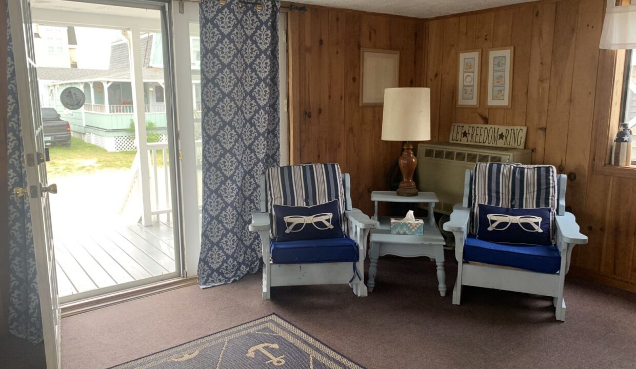 a living room with two chairs and a table.