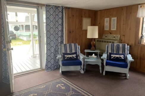 a living room with two chairs and a table.