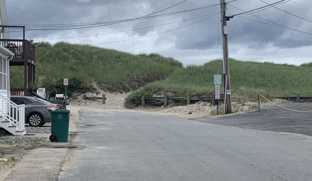 a street with a car parked on the side of it.