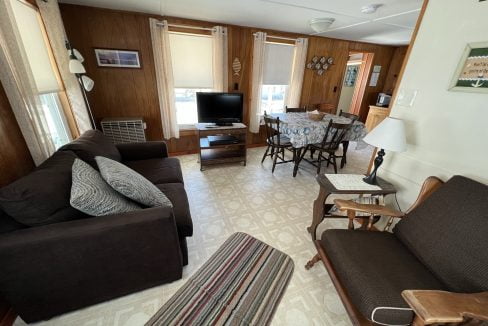 a living room filled with furniture and a flat screen tv.