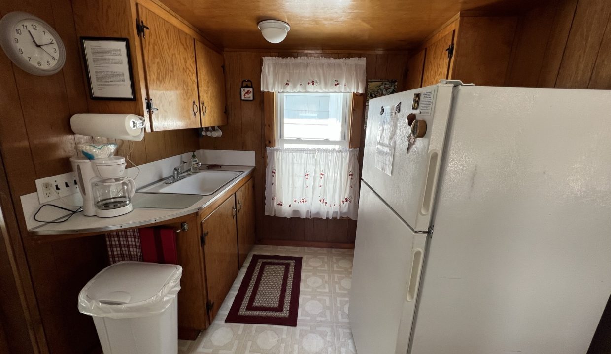 a white refrigerator freezer sitting inside of a kitchen.