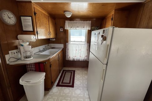 a white refrigerator freezer sitting inside of a kitchen.