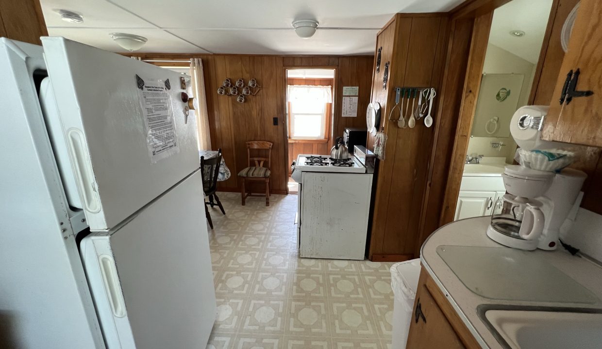 a white refrigerator freezer sitting inside of a kitchen.