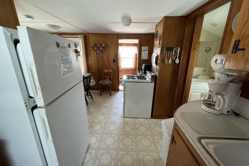 a white refrigerator freezer sitting inside of a kitchen.