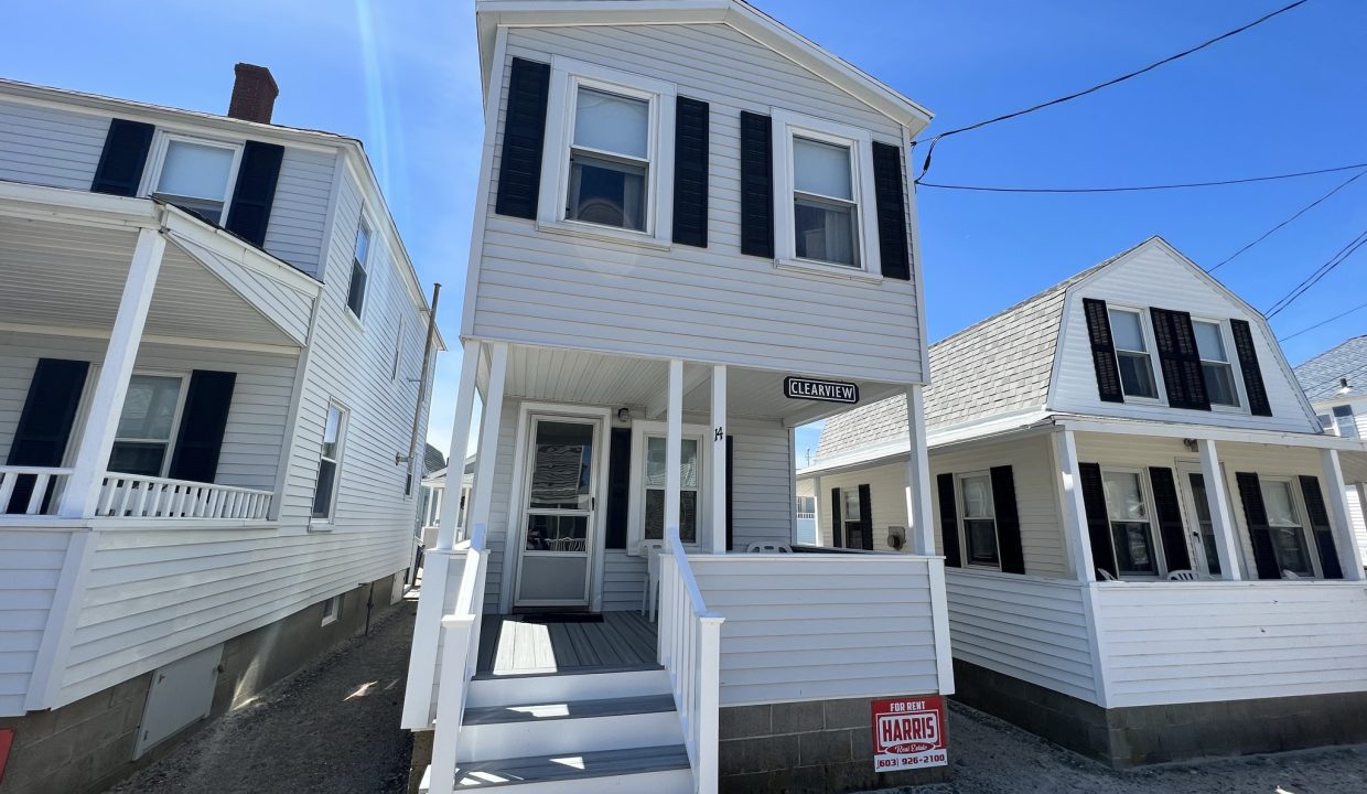 a couple of white houses sitting next to each other.