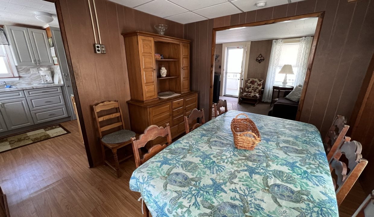 a dining room table with a basket on top of it.