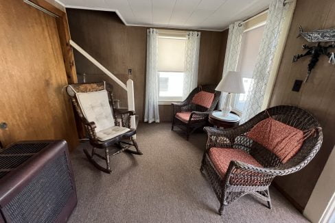 a living room filled with furniture and a flat screen tv.