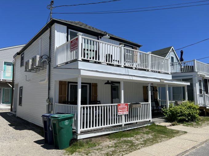 a two story house with a balcony and balconies.