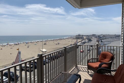 a view of a beach from a balcony.