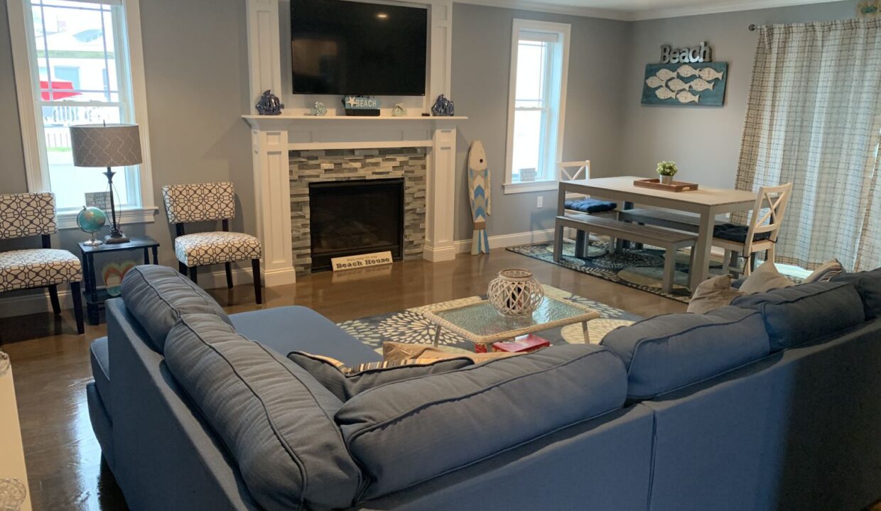 a living room filled with furniture and a fire place.