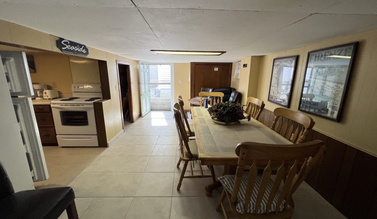 a kitchen with a table and chairs in it.