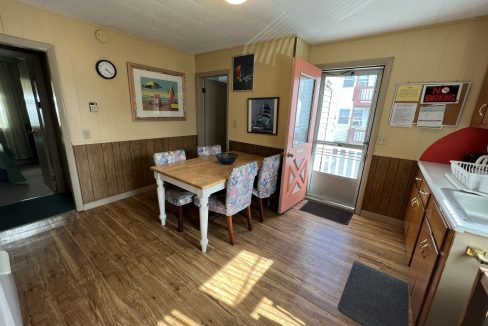 a dining room with a table and chairs.