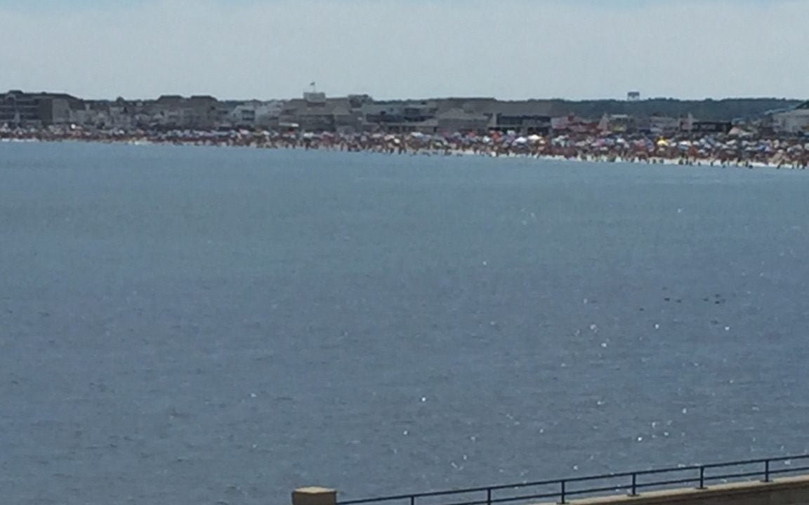 a large body of water next to a road.