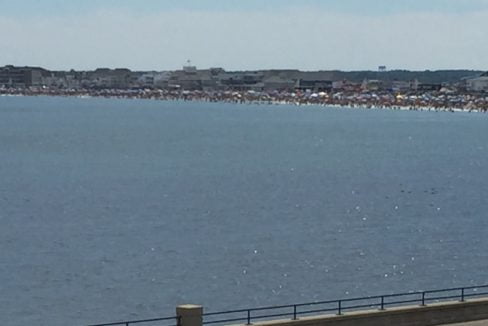 a large body of water next to a road.