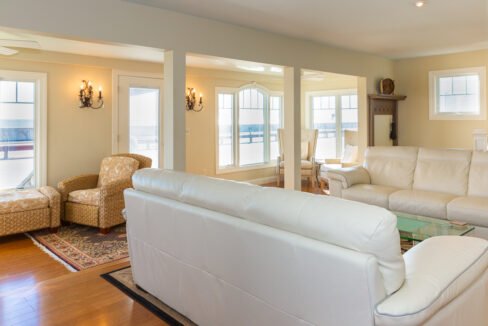 a living room filled with furniture and a fire place.