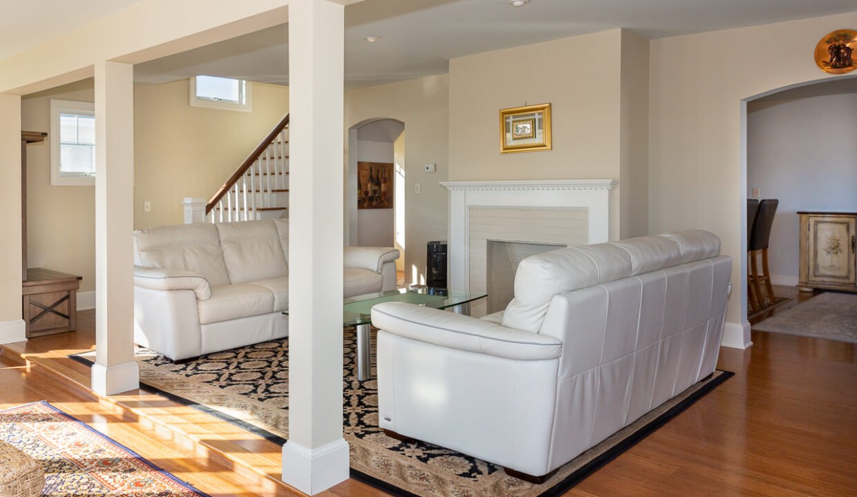 a living room filled with furniture and a fire place.