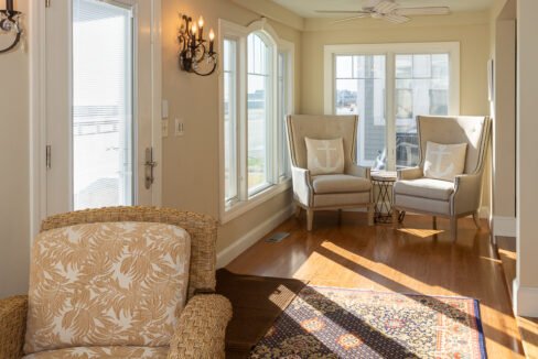 a living room filled with furniture and a rug.