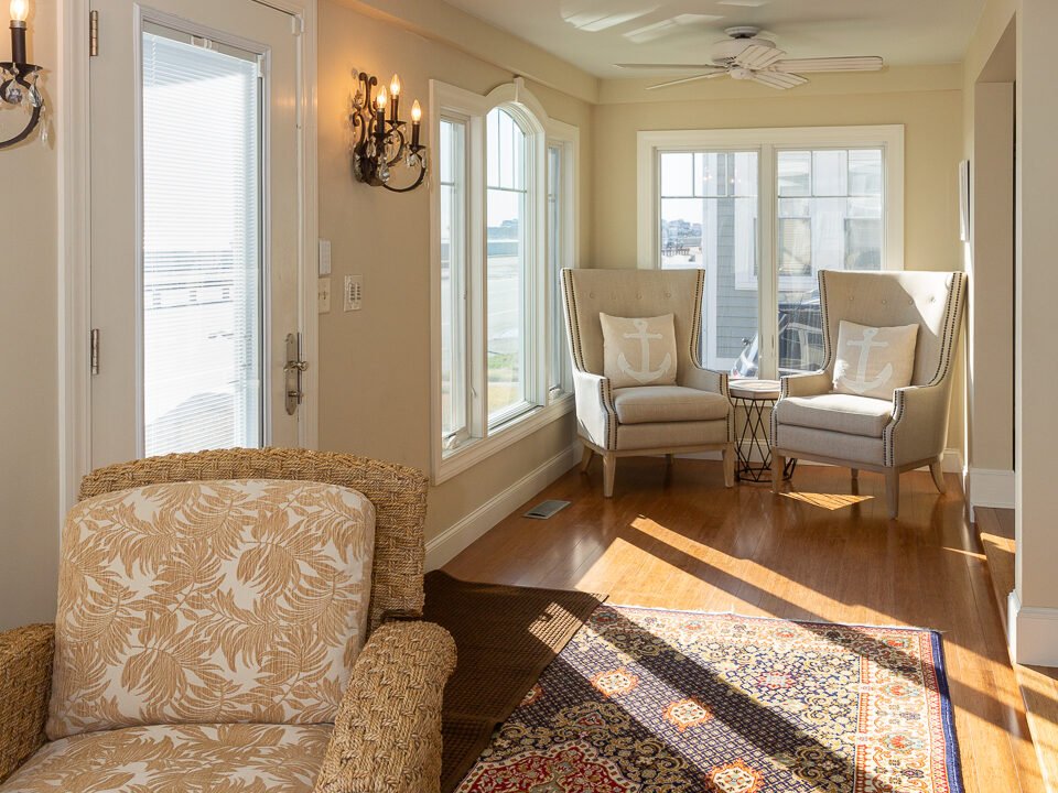 a living room filled with furniture and a rug.