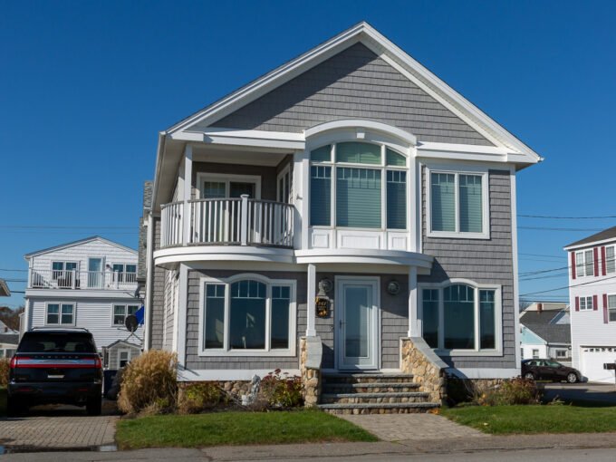 a house with a car parked in front of it.