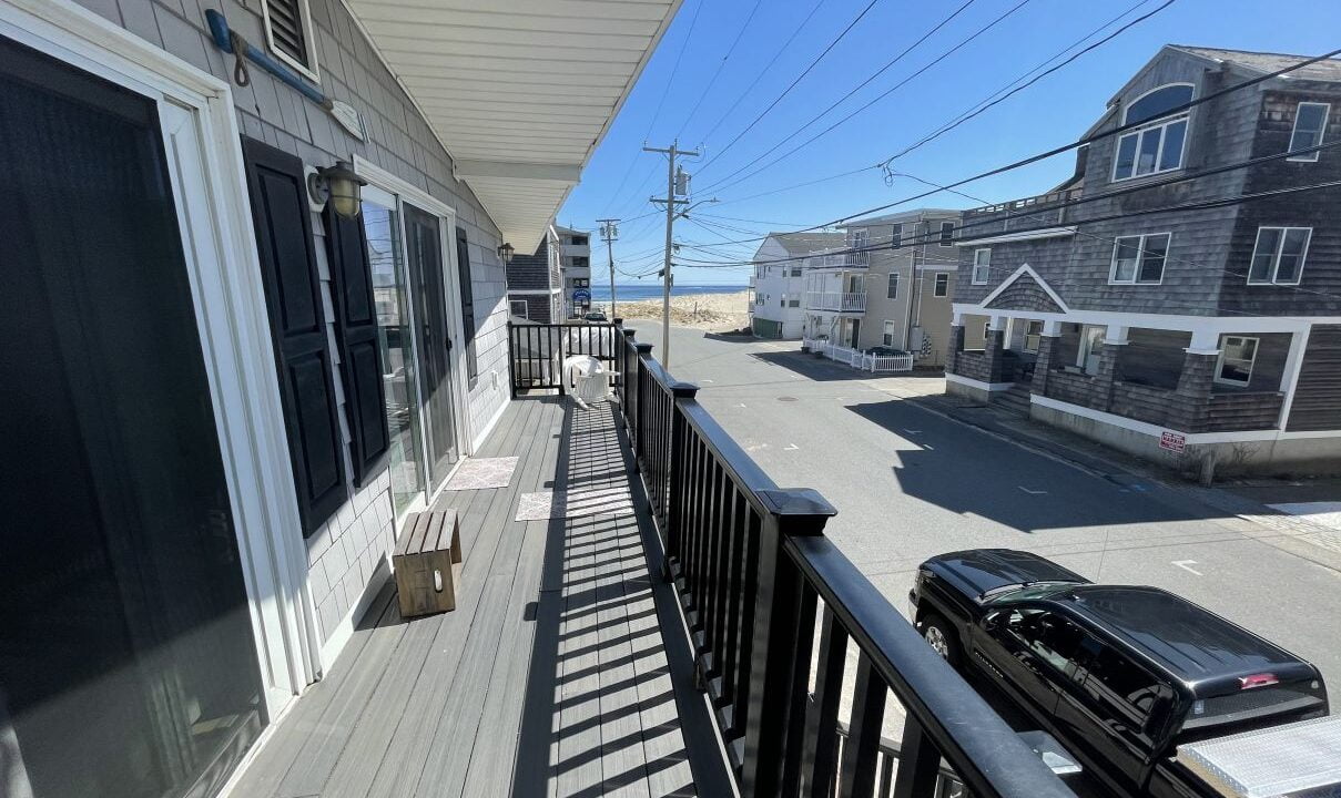 a balcony with a car parked on the side of it.