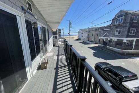 a balcony with a car parked on the side of it.