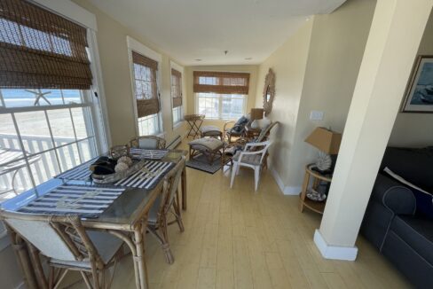 a room with a table, chairs and a couch.