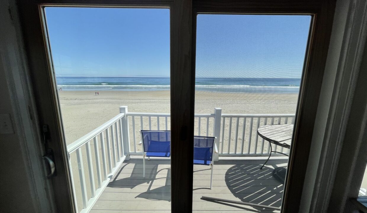 a view of the beach from a balcony.