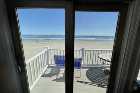 a view of the beach from a balcony.