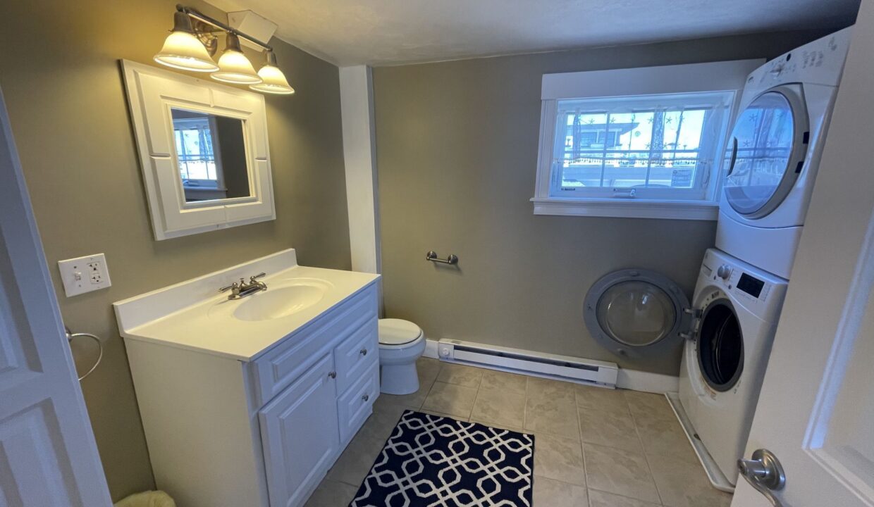 a bathroom with a washer and dryer in it.