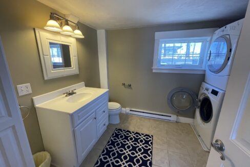 a bathroom with a washer and dryer in it.