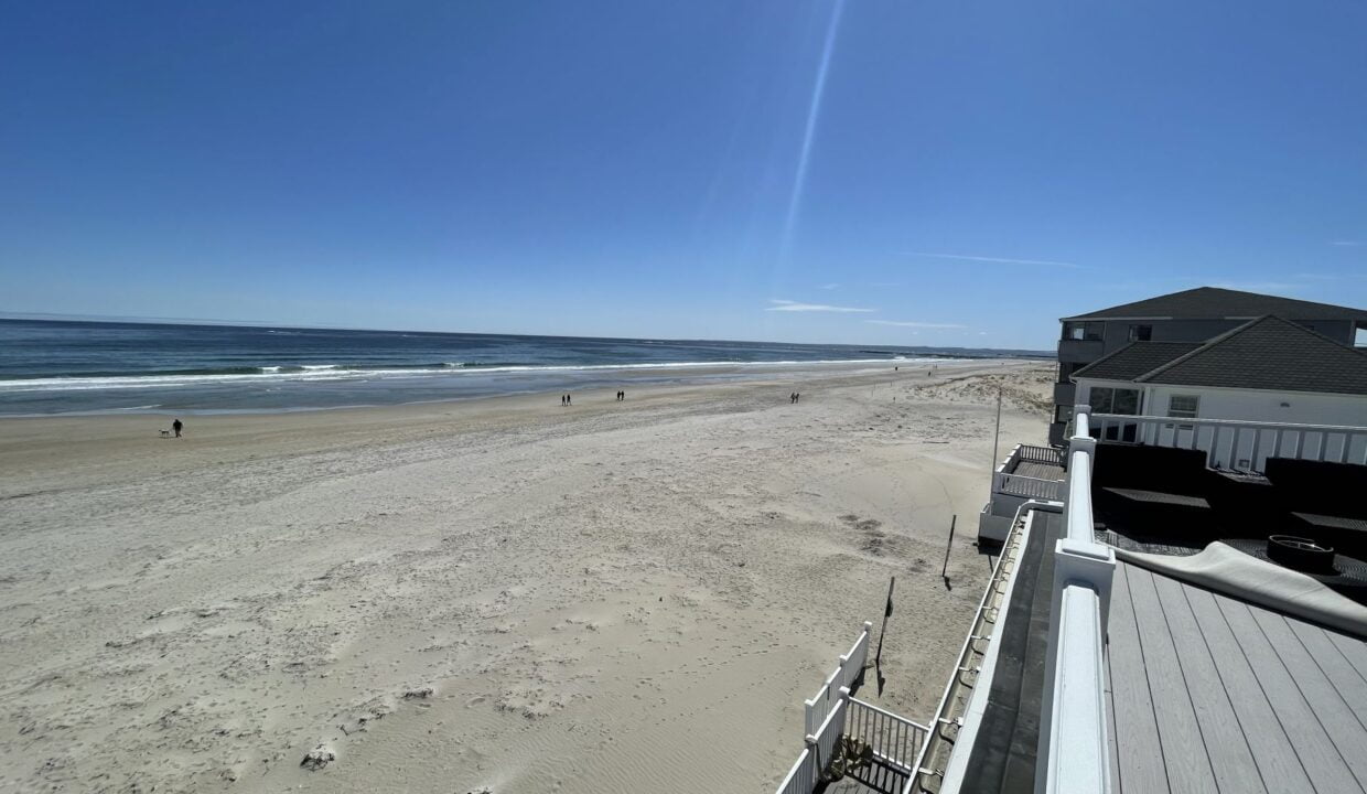 a view of a beach from a balcony.