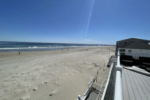 a view of a beach from a balcony.