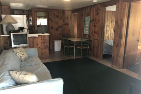 a living room filled with furniture and a flat screen tv.