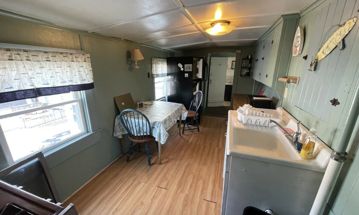 a kitchen and dining area of a mobile home.