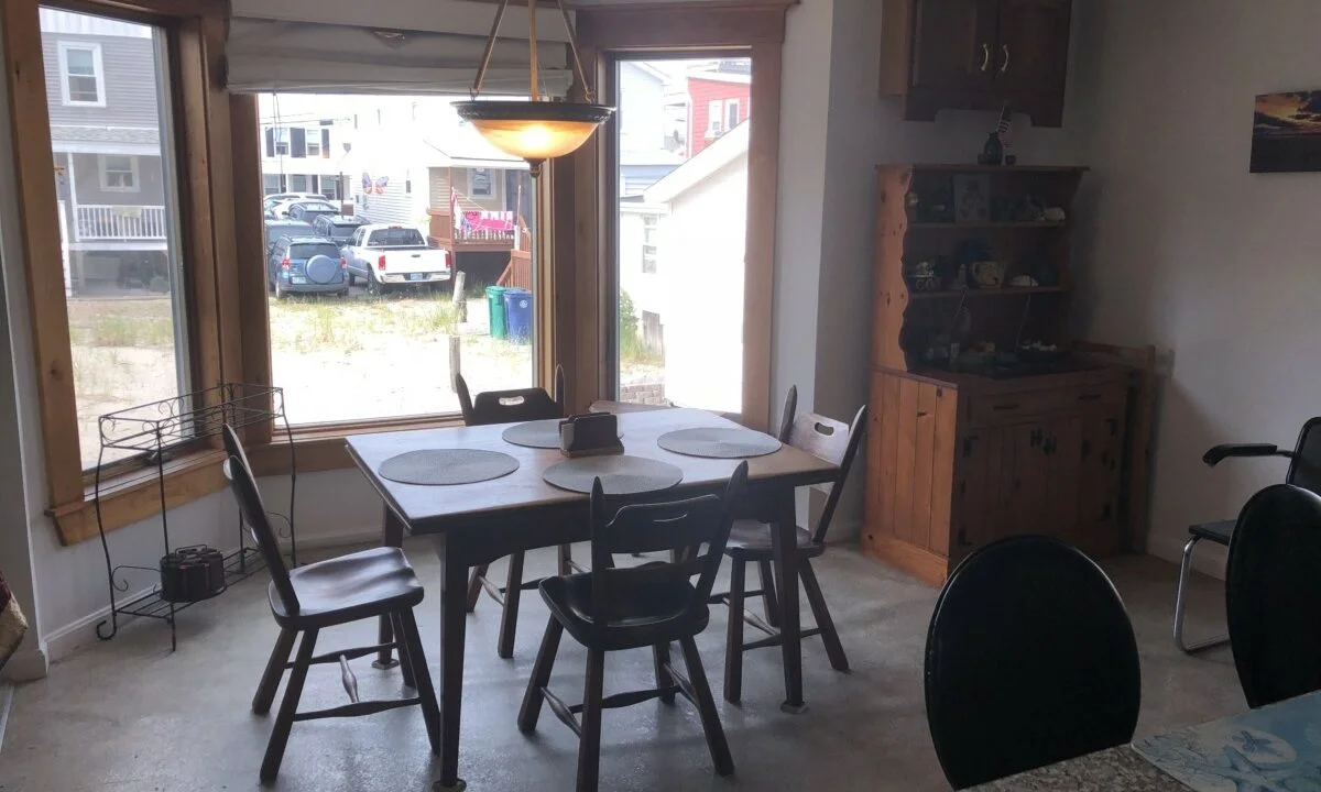 a kitchen with a table and chairs in it.
