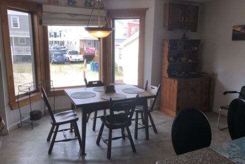 a kitchen with a table and chairs in it.