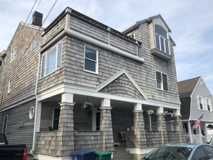 a car is parked in front of a house.