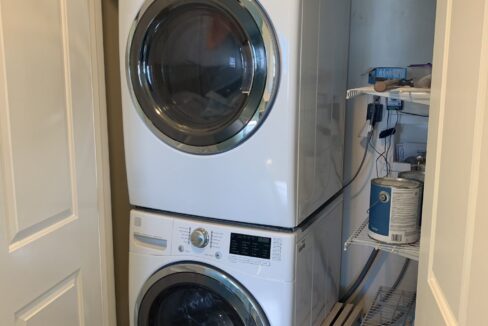 a washer and dryer in a small room.