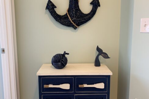 a blue cabinet with an anchor on top of it.