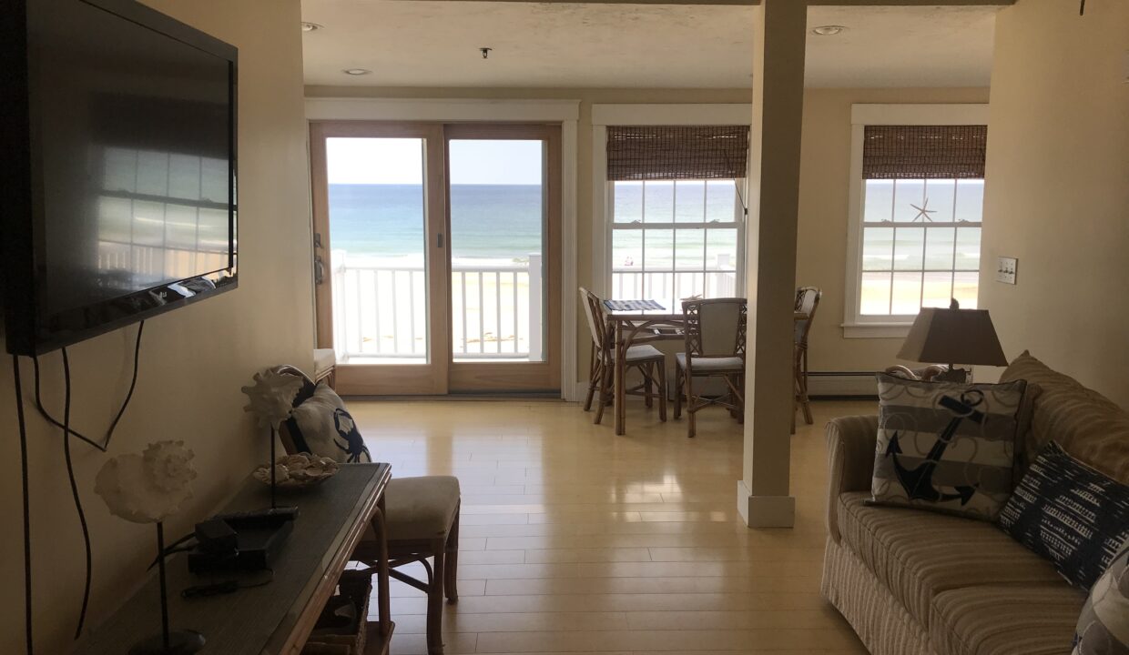 a living room filled with furniture and a flat screen tv.