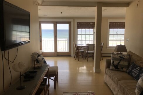 a living room filled with furniture and a flat screen tv.