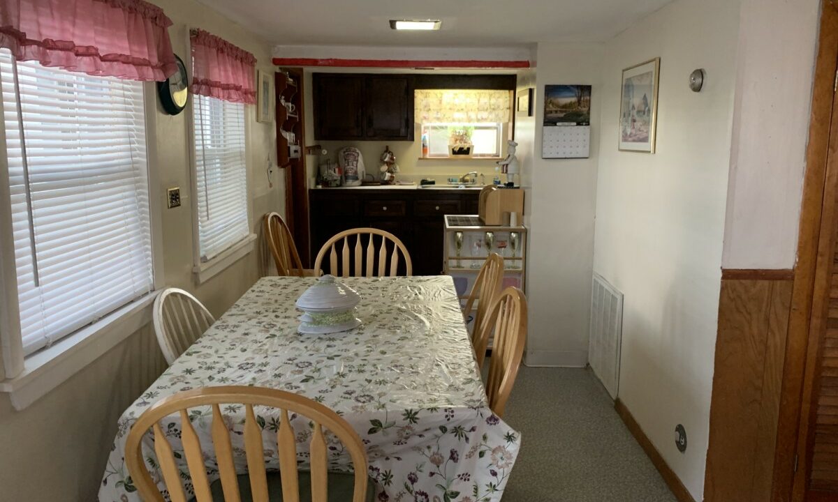 a kitchen with a table and chairs in it.